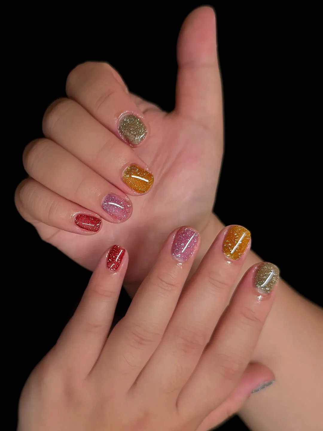 Jelly glitter gel manicure in amber, ruby and gold at L2 Nail Salon Mountain View