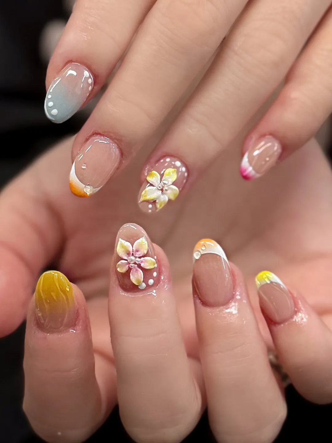 Pastel almond gel manicure with floral charms at L2 Nail Salon Mountain View